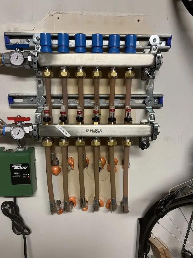 Plumber performing Water Heater Repair at a residential property in Fairport